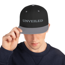 Load image into Gallery viewer, Unveiled Silver Font Snapback Hat
