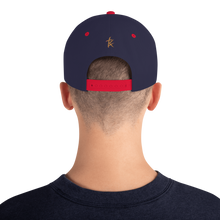 Load image into Gallery viewer, Unveiled gold/font Snapback Hat
